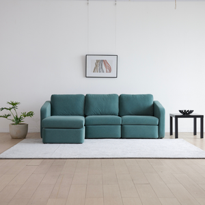 Sofá modular 3 plazas con pouf Konekt azul con chaise longue izquierda