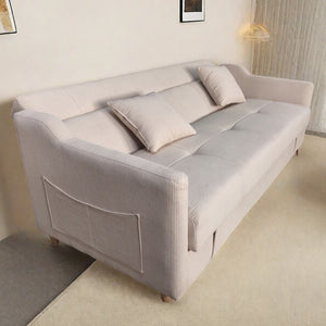 Sofá cama con arcón de terciopelo canalé beige 3 plazas Adare con bolsillo lateral