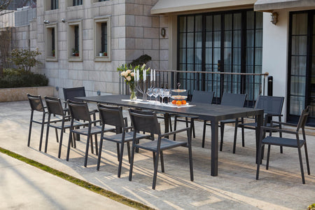 Consola extensible de aluminio y 12 sillas